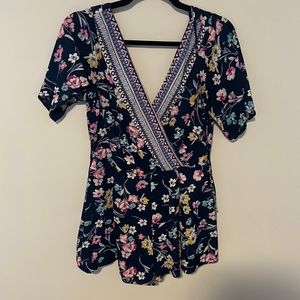 Francesca’s Floral navy blue romper